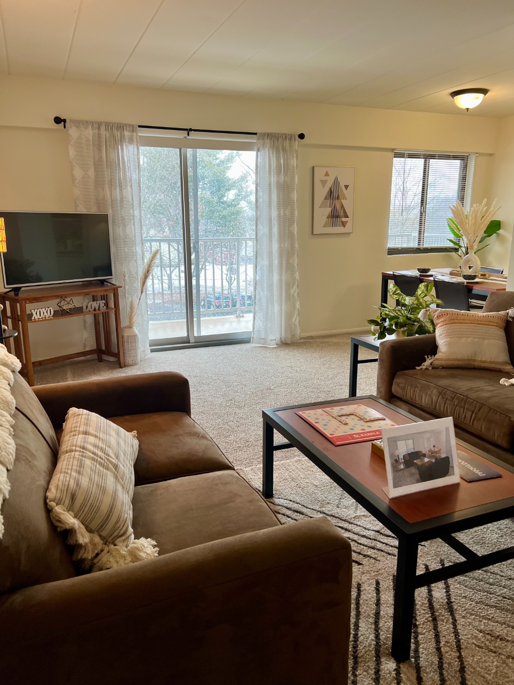 Model living room opening onto a private balcony at Parkway Plaza Model living room opening onto a private balcony at Parkway Plaza